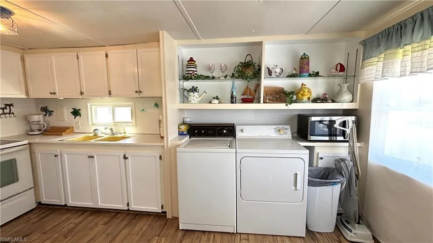Full-size washer and dryer are conveniently located in the Kitchen.