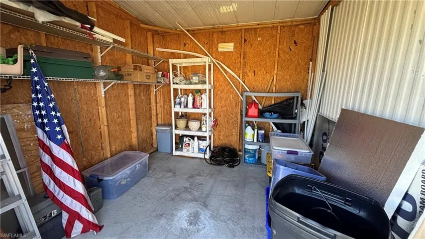 Roll up the garage door and drive your golf cart in or use this ample space for storage.