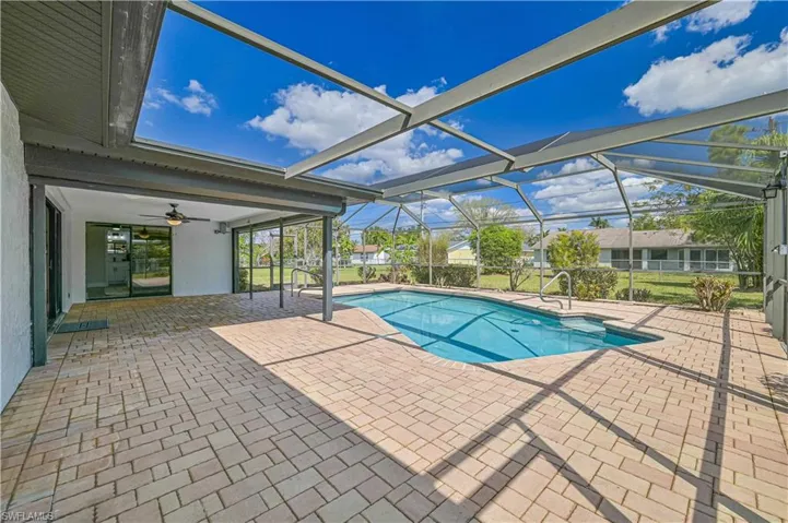 beautiful pool area with paver and cage
