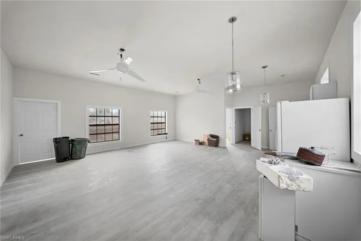 Miscellaneous room with ceiling fan and light wood finished floors