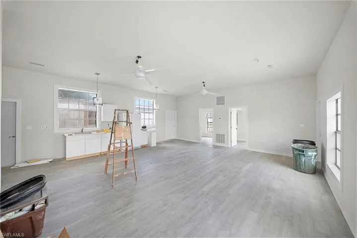 Living room featuring ceiling fan and light wood-type flooring