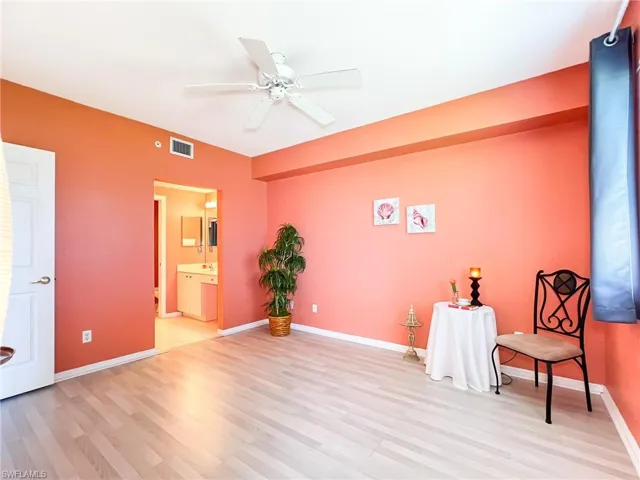 Unfurnished room featuring hardwood / wood-style floors and ceiling fan