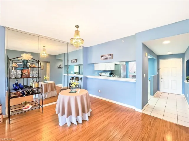 Dining room featuring a notable chandelier and light hardwood / wood-style flooring
