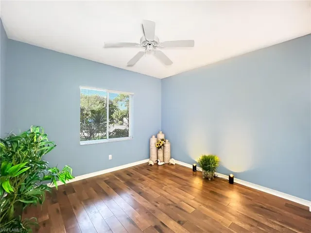 Spare room with ceiling fan and hardwood / wood-style floors