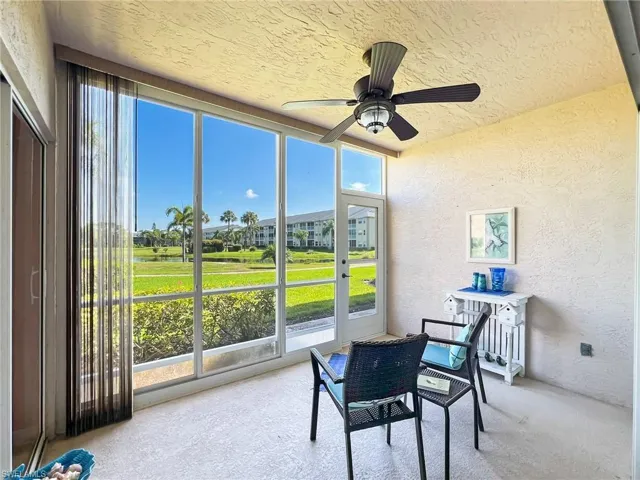 lanai featuring ceiling fan and a healthy amount of sunlight