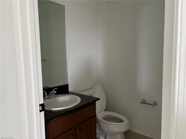 Bathroom featuring vanity and toilet
