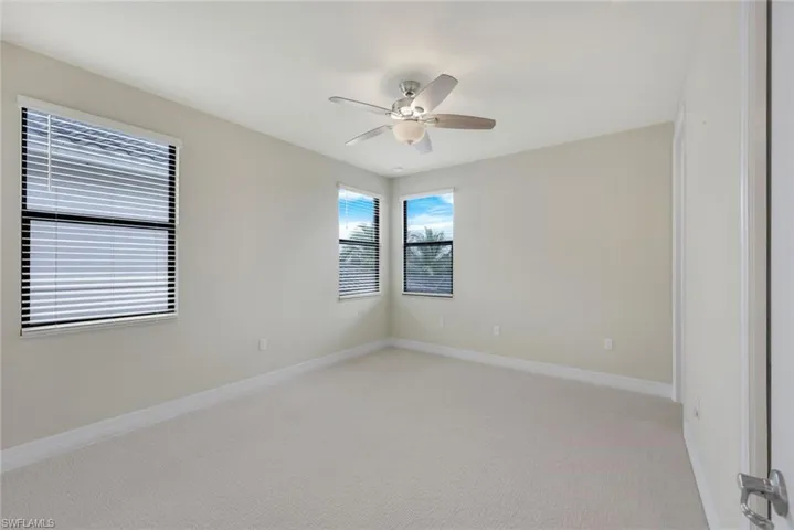 2nd Bedroom Upstairs featuring new carpet and ceiling fan