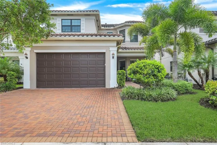 2-car garage and lush landscaping