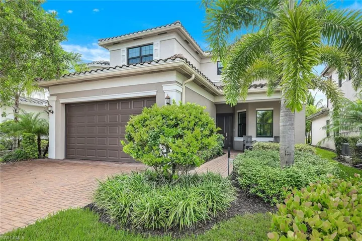 Mediterranean style home with paved driveway