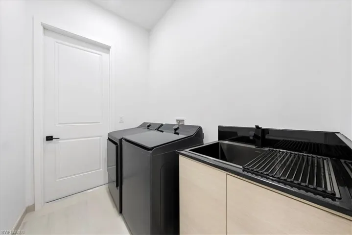 Laundry area featuring laundry area and washing machine and clothes dryer