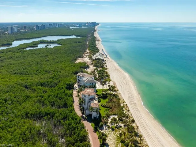 Drone / aerial view of waterfront with a beach