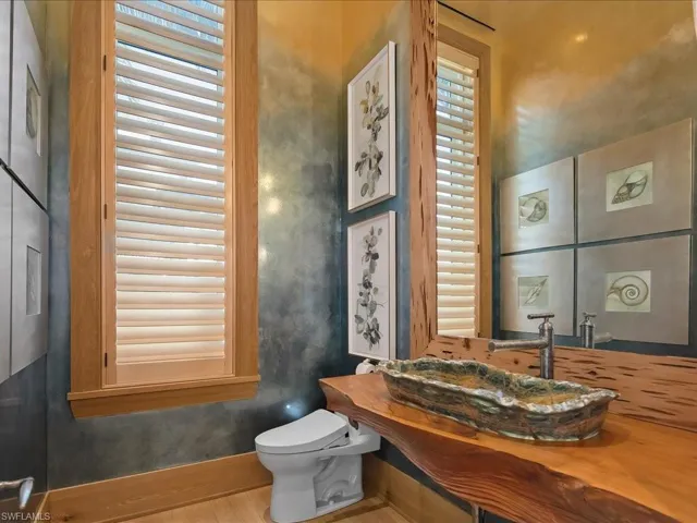 Bathroom with vanity and wood finished floors