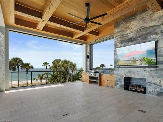 View of patio / terrace featuring an outdoor kitchen and a ceiling fan