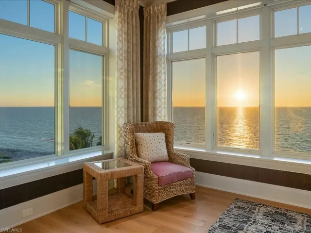 Sunroom featuring a water view and healthy amount of natural light
