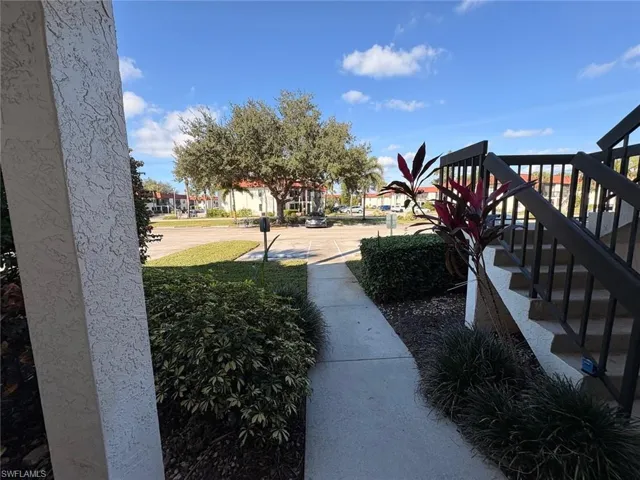 View of yard featuring stairs and a residential view