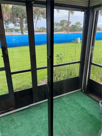 Unfurnished sunroom with a water view