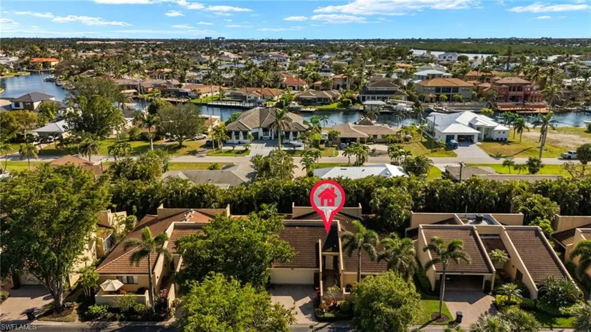 Aerial view featuring a water view and a residential view