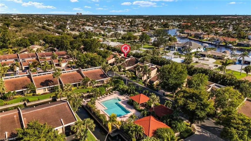 Drone / aerial view with a residential view and a water view