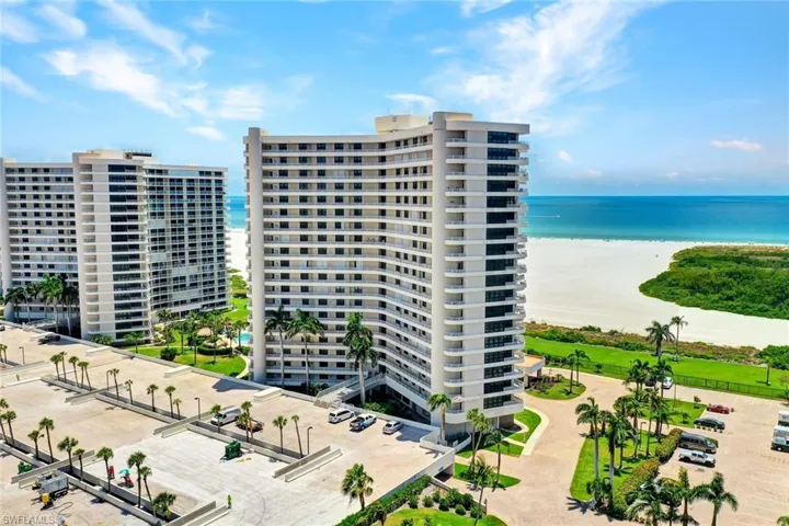 View of apartment building / complex featuring a water view