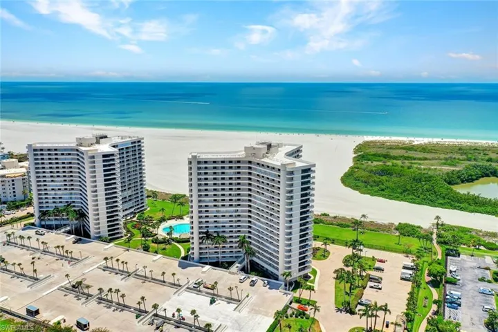 Aerial view of a large body of water and apartment complex / building