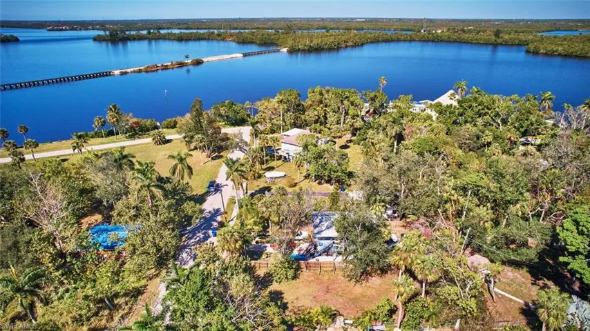Drone / aerial view featuring a water view and lot
