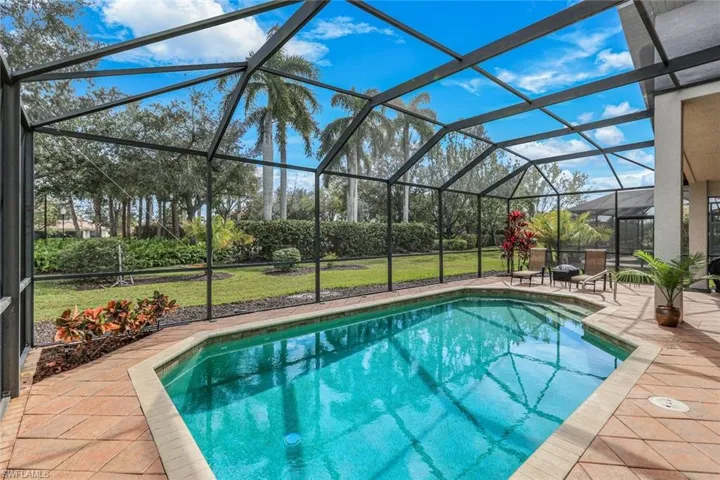 Private pool lined by 5 grand Royal Palms
