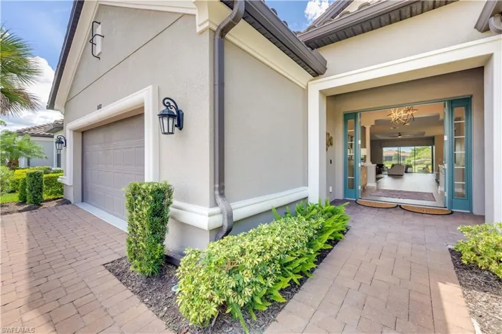 View of exterior entry featuring a garage