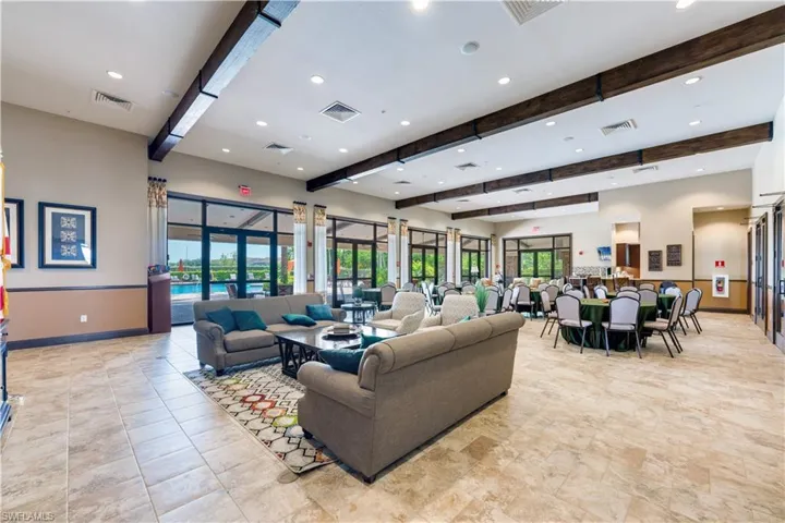 Living room featuring beam ceiling