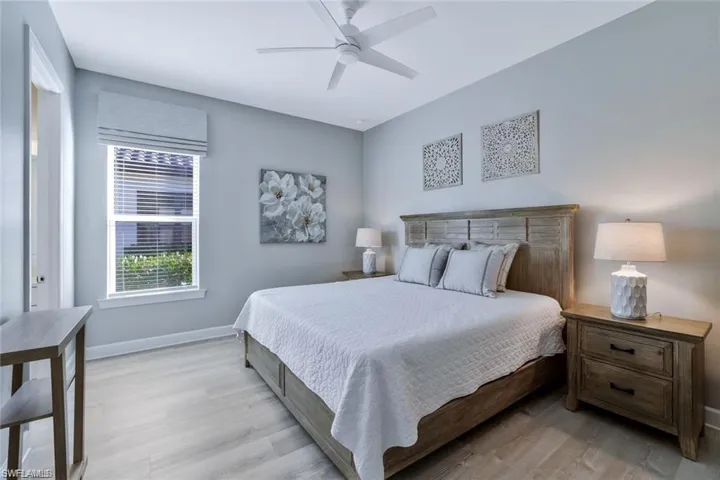 Bedroom featuring light hardwood / wood-style floors and ceiling fan