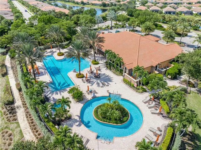 View of swimming pool featuring a water view and a patio area