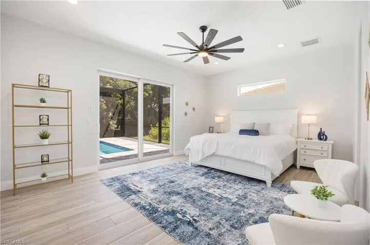 Bedroom featuring recessed lighting, access to exterior, light wood-style floors, and a ceiling fan