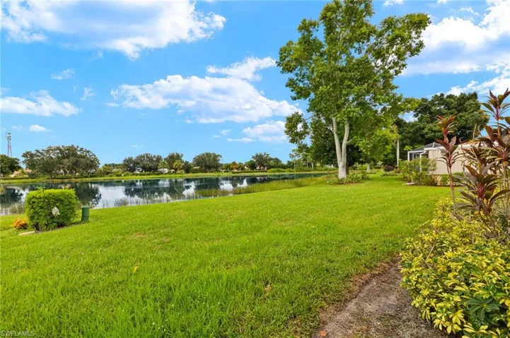 View of yard with a water view