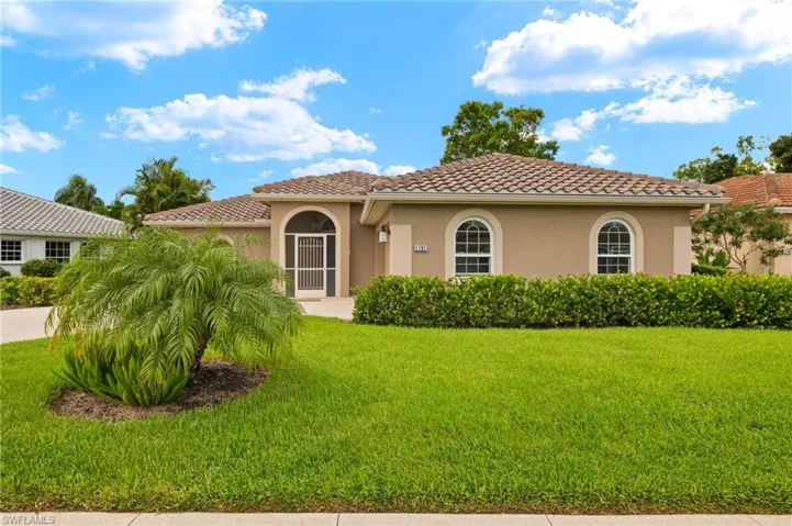 Mediterranean / spanish-style home featuring a front yard