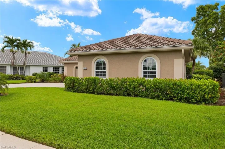 View of home's exterior with a lawn