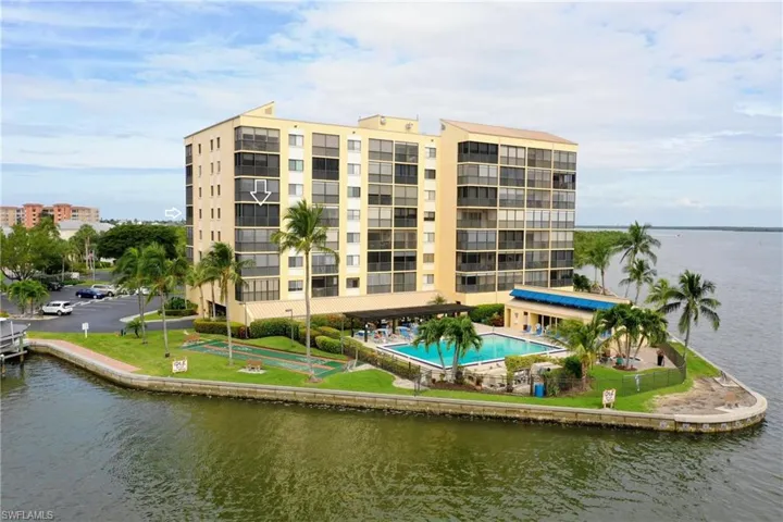 View of property featuring a water view and a community pool