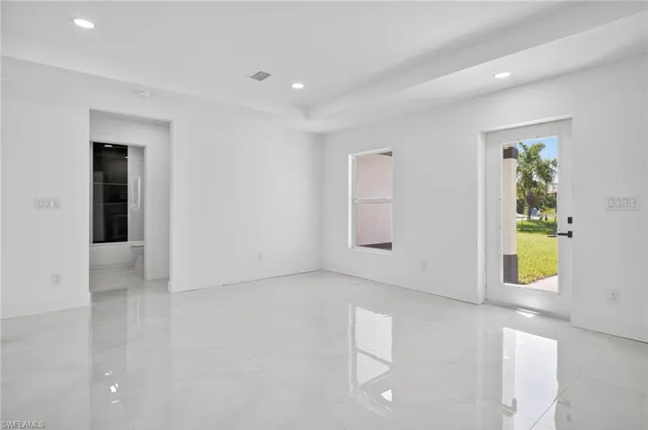 Spare room with recessed lighting and light tile patterned flooring