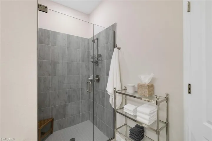Ensuite guest bathroom with frameless glass shower door