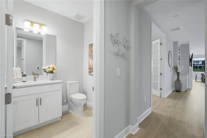 Bathroom featuring vanity and light wood-style floors