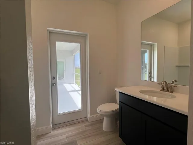Bathroom with vanity and wood finished floors