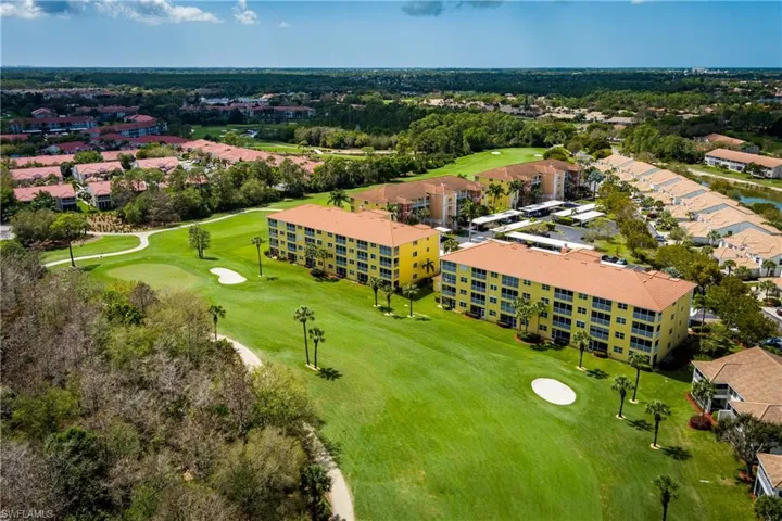 Aerial view of apartment complex and a golf club
