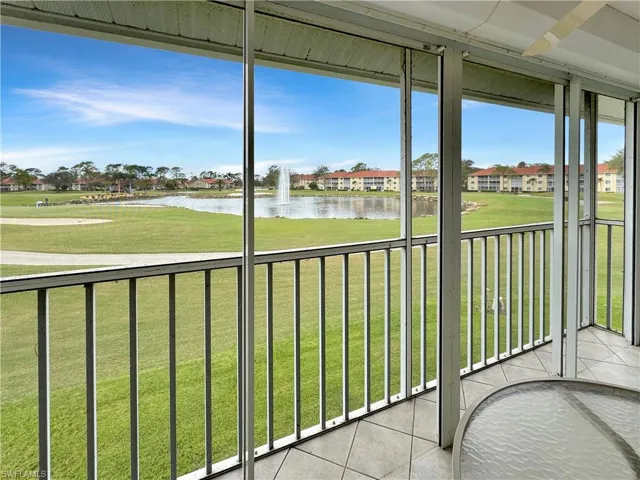 Unfurnished sunroom with a water view