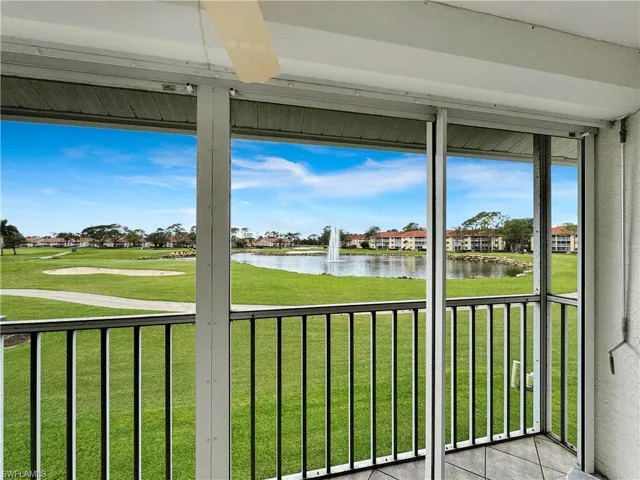 Unfurnished sunroom featuring a water view