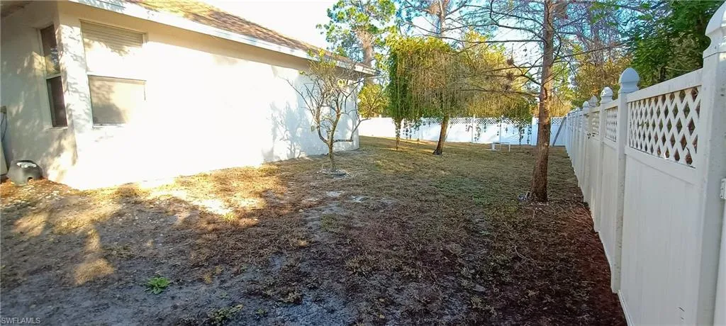 View of fenced backyard