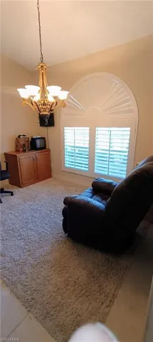 Living area featuring a chandelier