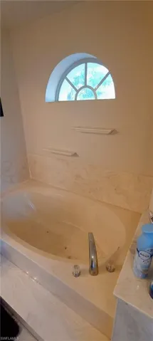 Full bath with a garden tub