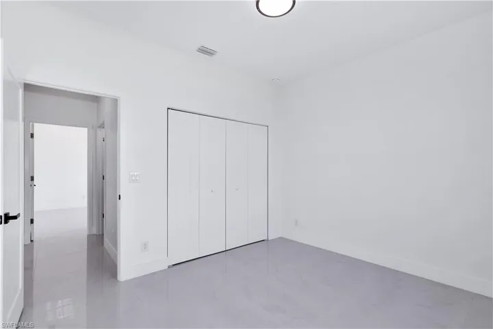 Unfurnished bedroom with a closet
