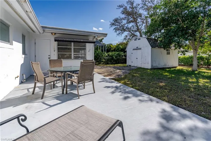 View of patio / terrace with a shed