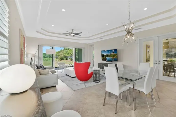 Walls of Glass and Contempory Chandelier set the tone for modern living