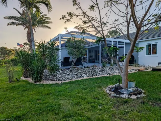 View of yard featuring a patio and a lanai