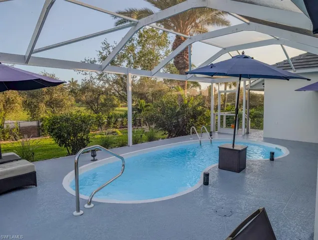 Pool featuring a patio and a lanai